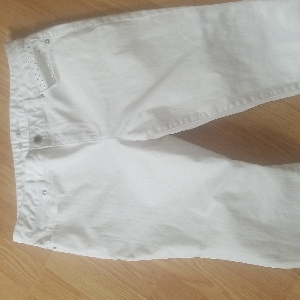 Michael Kors white jeans with crystal rhinestone accents on back pocket